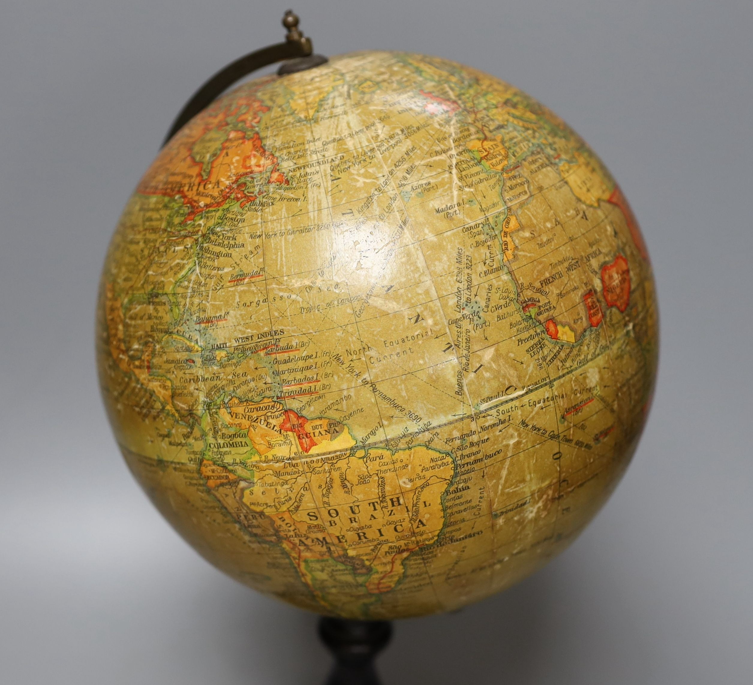 A Geographia 8 inch terrestrial globe, ebonised stand. 37cm tall
